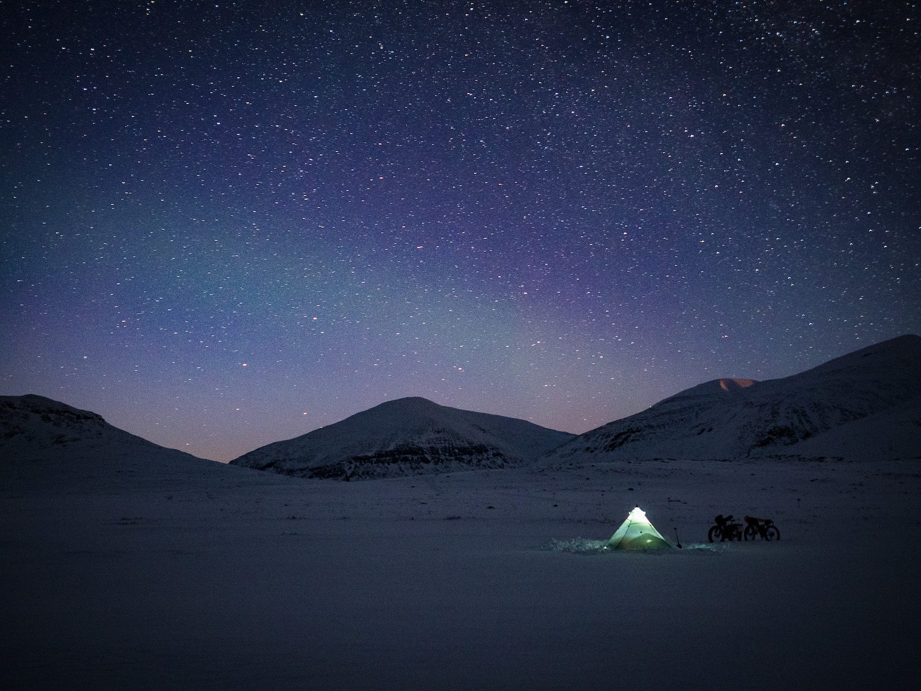 "Night times often make indelible impressions. Although we never saw the penetrating northern lights we saw in Iceland, we lay in the tent, cosy in a sleeping bag, gazing out as the stars pirouetted and the faint aurora danced above, whilst our breath tinkled and grew crystals around the sleeping bag hood. It was something incredibly special." ~Annie Le Evans