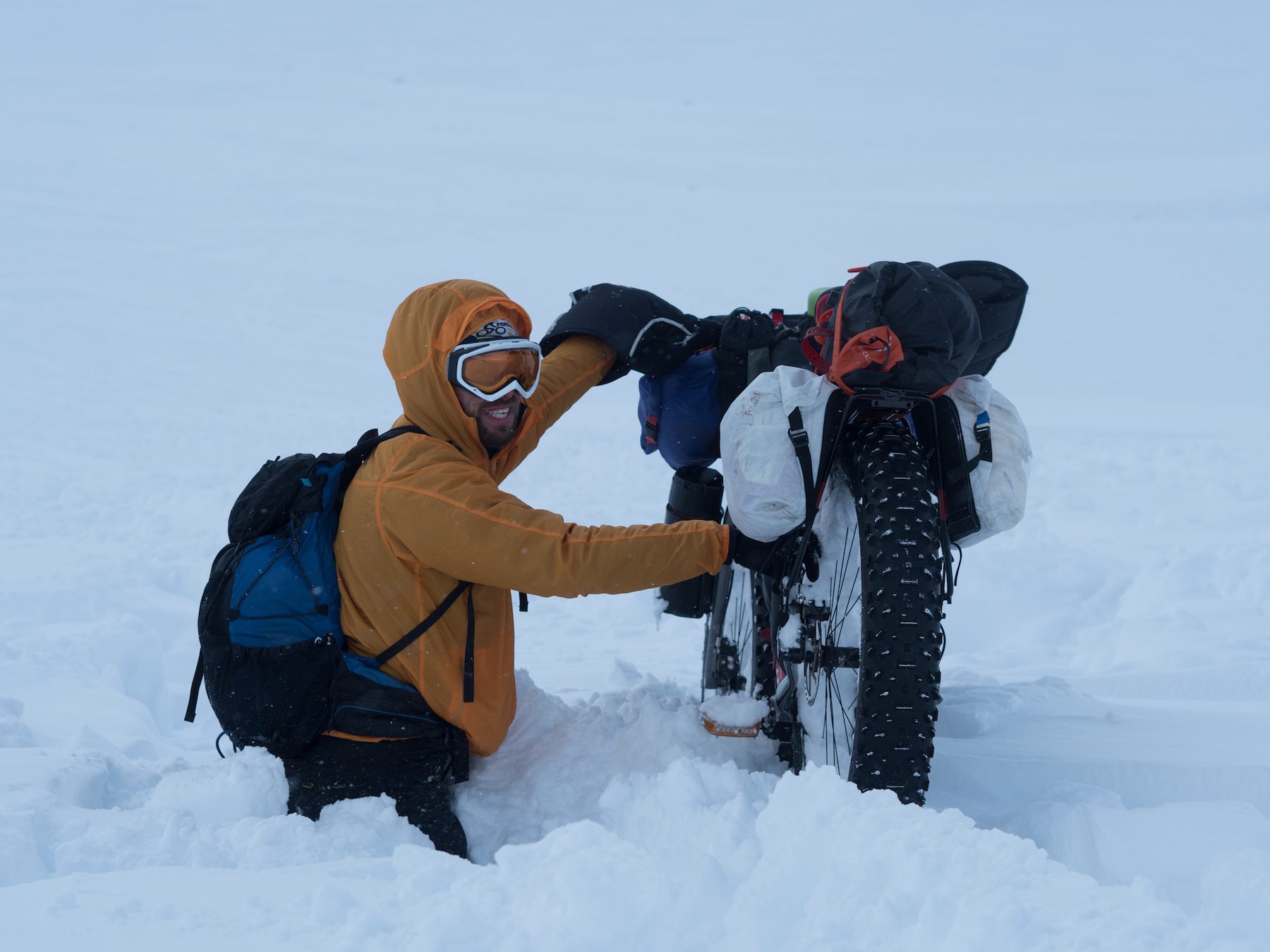 "The silencing blanket of fresh snowfall might cover the smaller features of a landscape, but that doesn’t mean that they aren’t there… A sense of humour was needed to get across the deep drifts of the mountain valleys, where the strong winds had dumped metres of snow into burn lines and gulleys. Falling up to your thighs for the twelfth time that afternoon kind of stooped being funny after a while, but the brief glimpses of the coires and summits surrounding us made up for it when a break in the cloud allowed them to reveal themselves momentarily. I think this might have been ‘pretend smile’ mode though…" ~Huw Oliver 