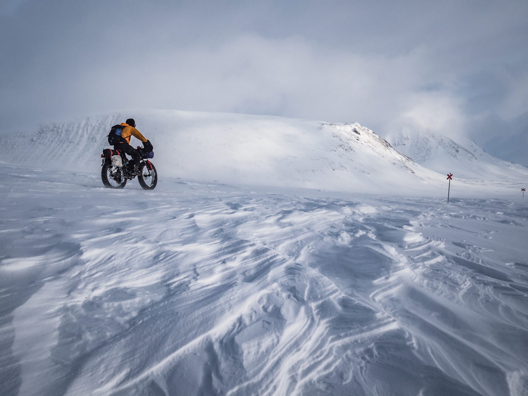 "Maybe because I’m not from a super snowy country, I still find a magic in snow covered landscapes. The snow is never the same, influenced and carved by wind before and after falling and temperature. As we rode with the gale force winds, it was almost like watching a mason at work, shaping the snow into new shapes before our eyes. These huge areas of sastrugi were stunning, often causing us to stop to simply admire them." ~Annie Le Evans 